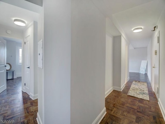 hallway featuring baseboards
