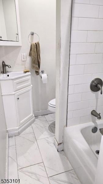 bathroom with vanity, bathtub / shower combination, toilet, and marble finish floor