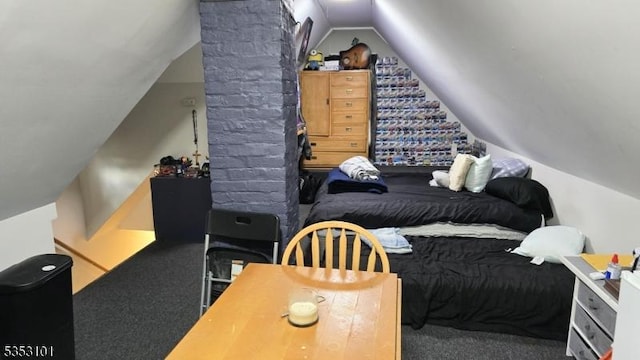 bedroom with carpet and vaulted ceiling
