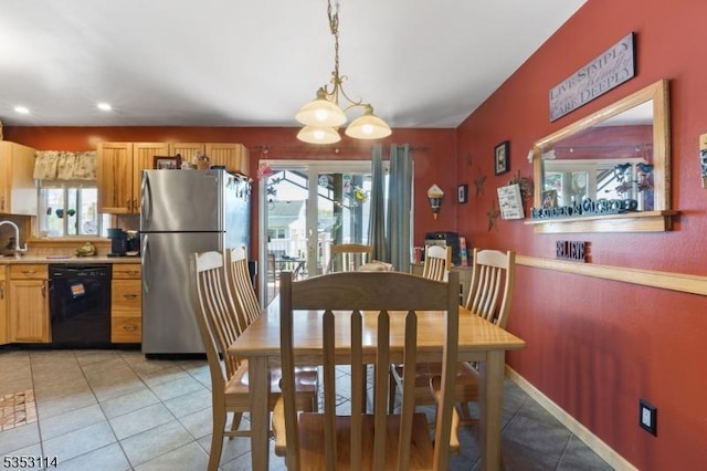 dining room featuring recessed lighting, light tile patterned floors, and an inviting chandelier