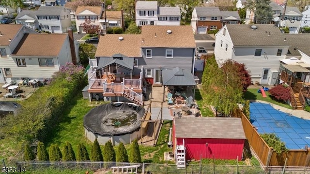 birds eye view of property with a residential view