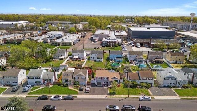 birds eye view of property with a residential view
