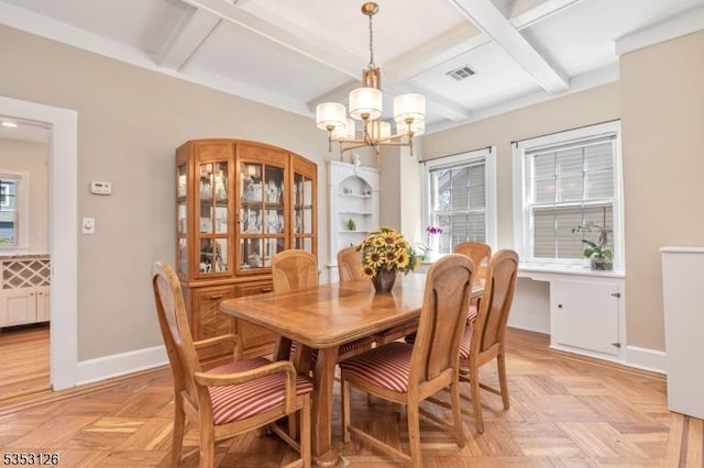 dining area featuring beam ceiling, a chandelier, baseboards, visible vents, and coffered ceiling