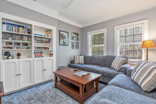 living area with ornamental molding