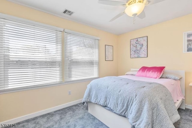 bedroom with visible vents, a ceiling fan, carpet, and baseboards