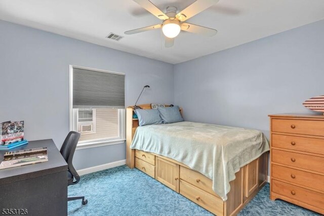 bedroom featuring baseboards, visible vents, ceiling fan, and carpet