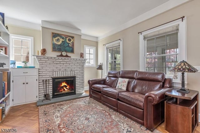 living area with a brick fireplace