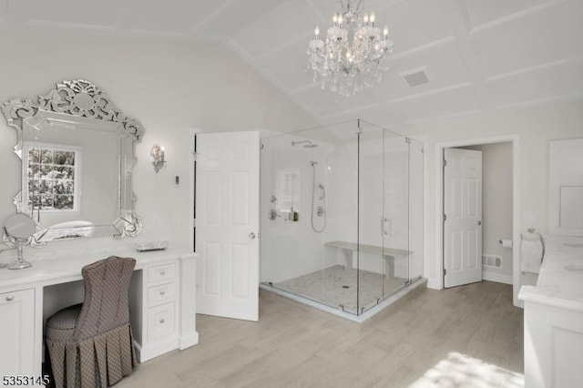 bathroom featuring visible vents, a stall shower, and wood finished floors