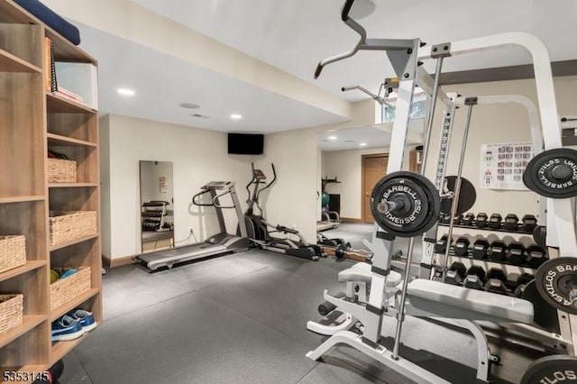workout area with recessed lighting