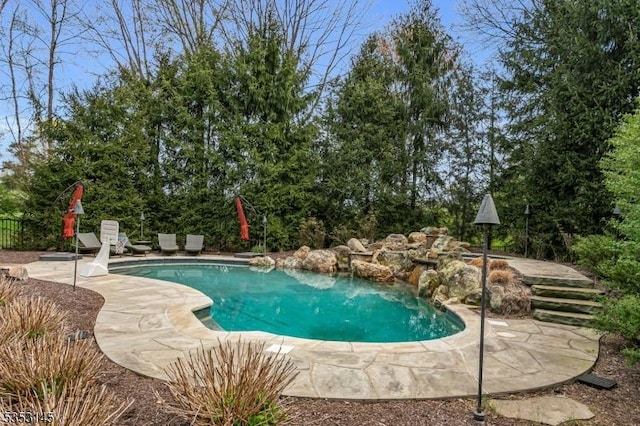 outdoor pool featuring a patio area