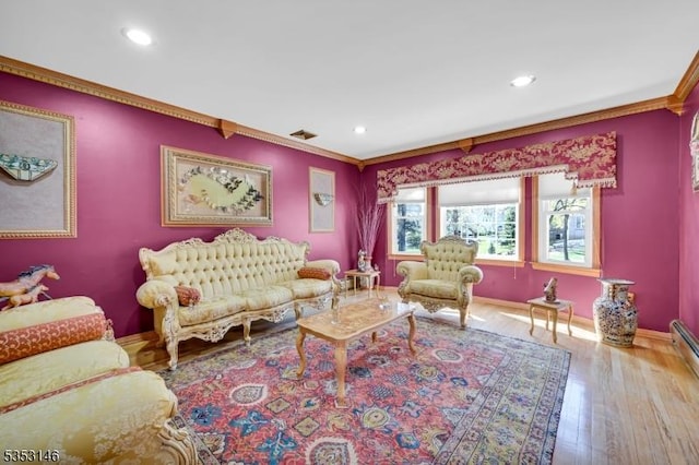living room featuring crown molding, recessed lighting, baseboards, and wood finished floors