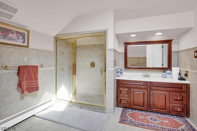 full bathroom featuring visible vents, tile walls, tile patterned floors, a baseboard heating unit, and a shower stall