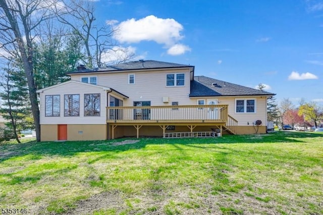 back of property featuring a yard, a deck, and stairs