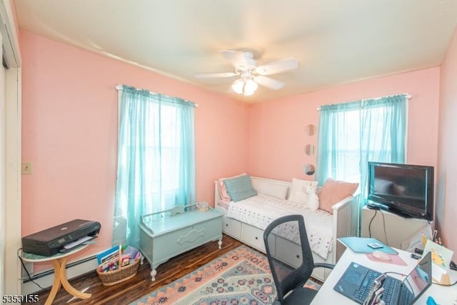 bedroom featuring a ceiling fan and wood finished floors
