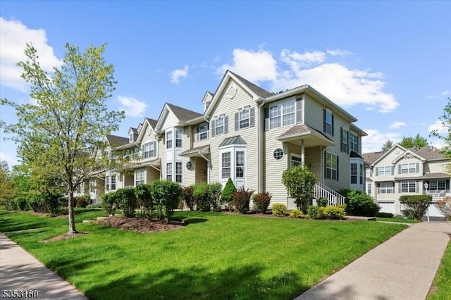view of property featuring a front yard