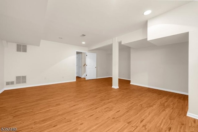finished below grade area featuring baseboards and visible vents