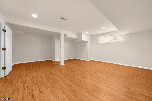 below grade area with baseboards, recessed lighting, and light wood finished floors