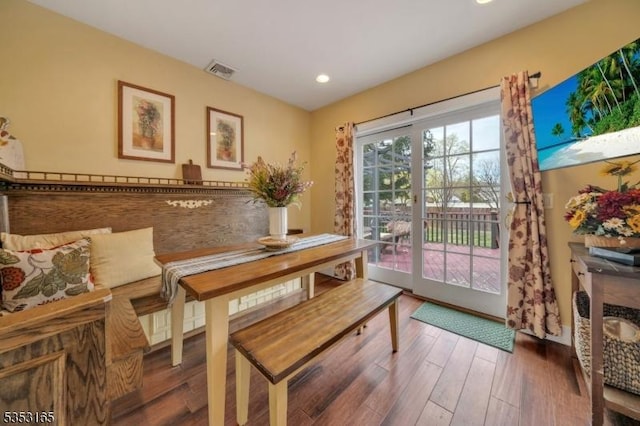 dining room with wood finished floors, visible vents, and recessed lighting
