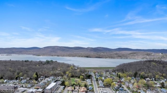birds eye view of property featuring a residential view and a water and mountain view