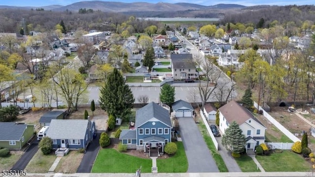 aerial view with a mountain view and a residential view