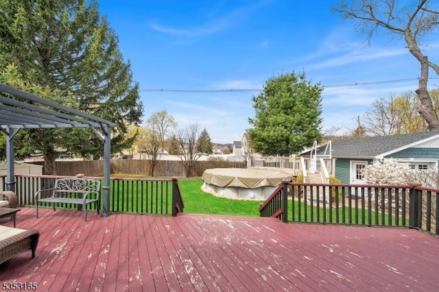 deck with a fenced backyard, stairs, a yard, and a pergola