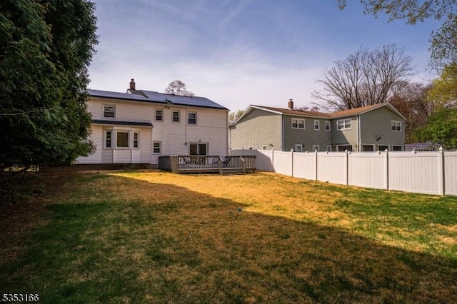 1077 Allenwood Dr, Plainfield City, NJ 07060 - rear view of house with fence, a wooden deck, a chimney, and a yard