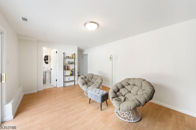 1077 Allenwood Dr, Plainfield City, NJ 07060 - living area featuring light wood-type flooring, baseboards, and visible vents