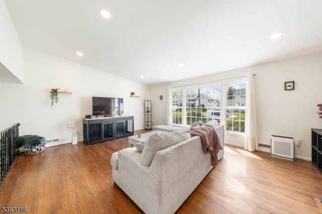 1077 Allenwood Dr, Plainfield City, NJ 07060 - living area featuring wood finished floors, recessed lighting, baseboards, and lofted ceiling
