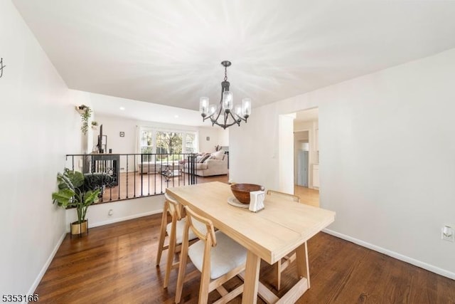1077 Allenwood Dr, Plainfield City, NJ 07060 - dining room featuring baseboards, an inviting chandelier, and wood finished floors