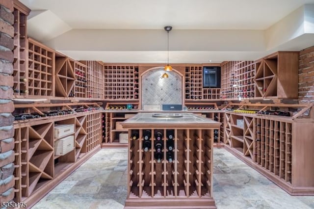 wine area featuring stone finish floor
