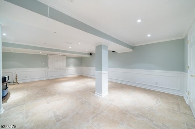 finished basement featuring recessed lighting, wainscoting, crown molding, and a decorative wall