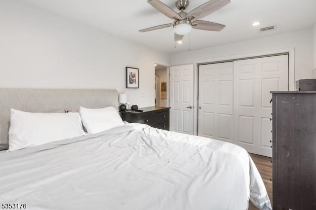 bedroom with visible vents, a closet, wood finished floors, ceiling fan, and recessed lighting