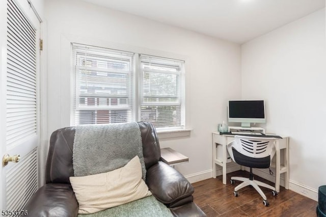 office area with baseboards and wood finished floors