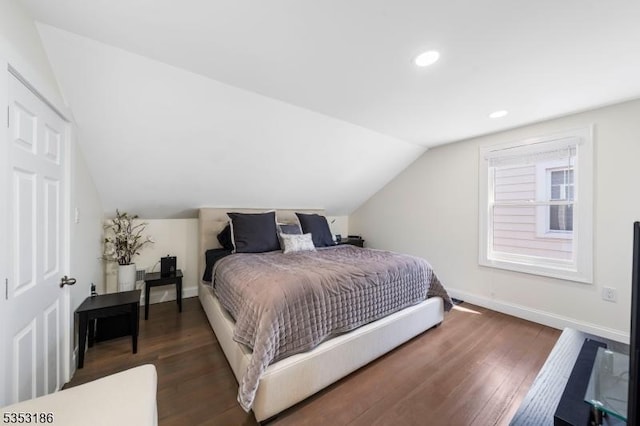 bedroom featuring recessed lighting, baseboards, wood finished floors, and lofted ceiling