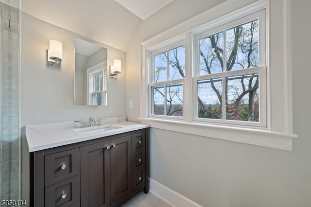 bathroom featuring baseboards and vanity