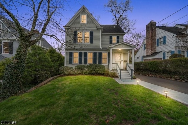 traditional-style home with a lawn