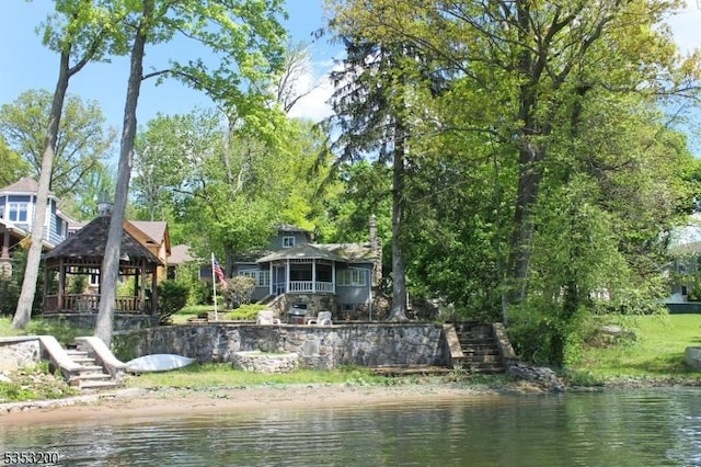 dock area featuring a water view and stairway