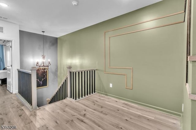 1 Sadie Cir Unit 1202, Union Twp, NJ 07083 - empty room featuring an inviting chandelier, wood finished floors, visible vents, and baseboards