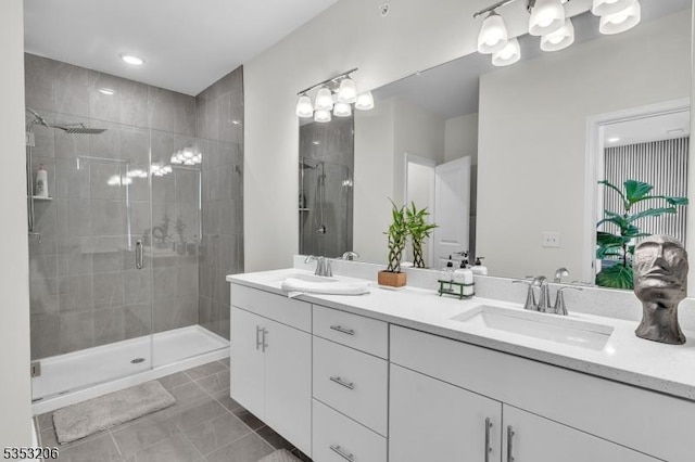 1 Sadie Cir Unit 1202, Union Twp, NJ 07083 - bathroom with tile patterned floors, a shower stall, double vanity, and a sink