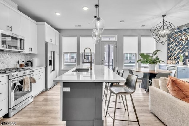 1 Sadie Cir Unit 1202, Union Twp, NJ 07083 - kitchen with recessed lighting, stainless steel appliances, light countertops, backsplash, and a sink
