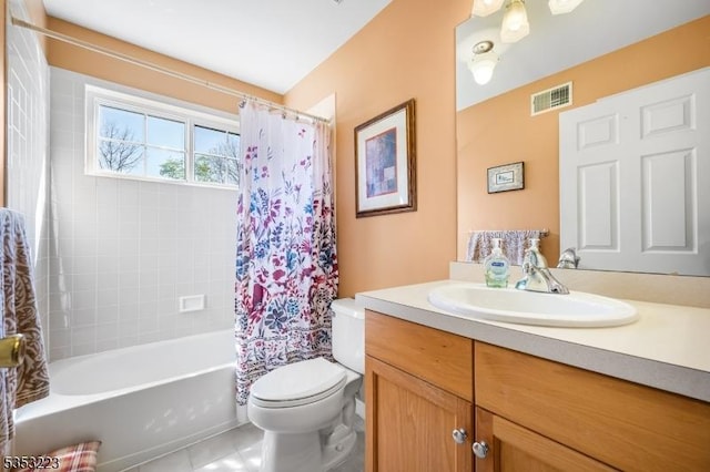 bathroom featuring visible vents, vanity, toilet, tile patterned floors, and shower / bath combo