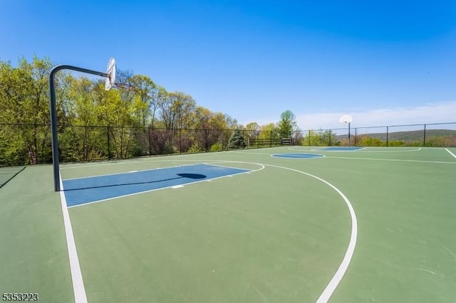view of sport court with community basketball court and fence