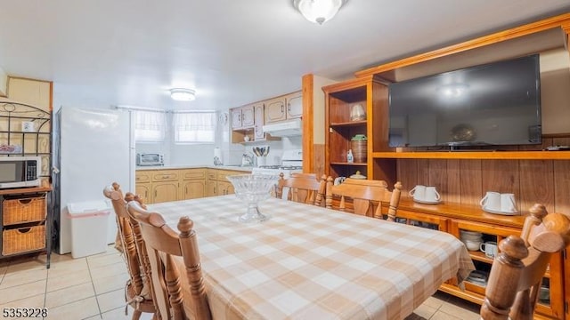 dining space featuring light tile patterned floors