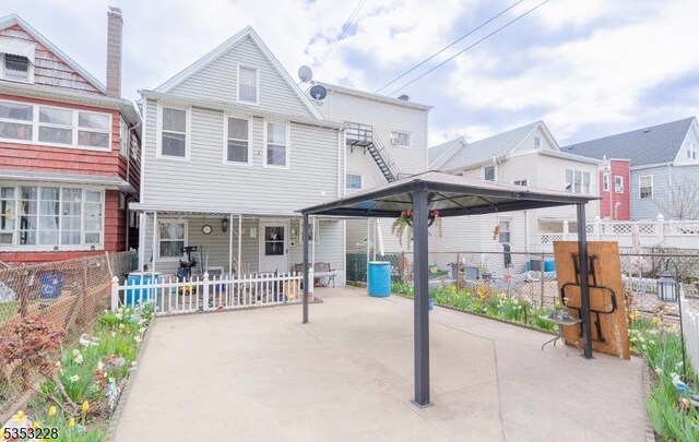 exterior space with fence and a patio area