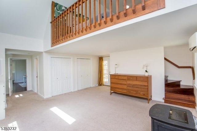 2252 Daniel Bray Hwy, Kingwood Twp, NJ 08559 - living area featuring baseboards, carpet, stairs, and high vaulted ceiling