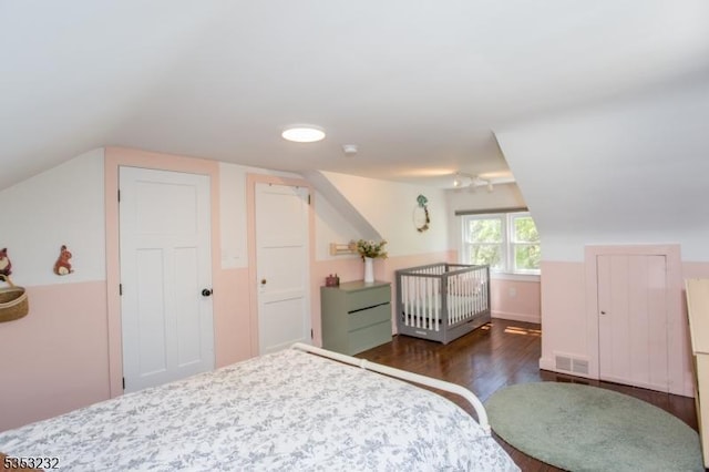 2252 Daniel Bray Hwy, Kingwood Twp, NJ 08559 - bedroom featuring dark wood-type flooring, lofted ceiling, and visible vents