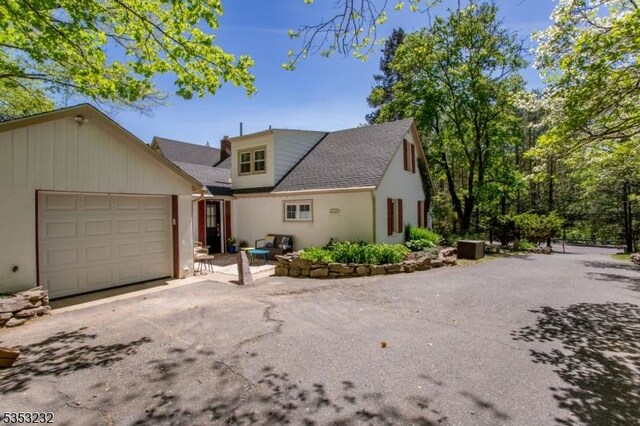 2252 Daniel Bray Hwy, Kingwood Twp, NJ 08559 - view of front of house featuring a garage and aphalt driveway