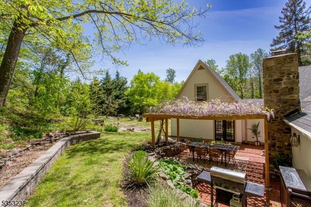 2252 Daniel Bray Hwy, Kingwood Twp, NJ 08559 - exterior space with a patio, a yard, and a chimney