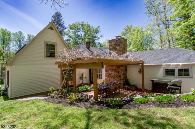 2252 Daniel Bray Hwy, Kingwood Twp, NJ 08559 - back of property with a lawn, a patio area, and a chimney