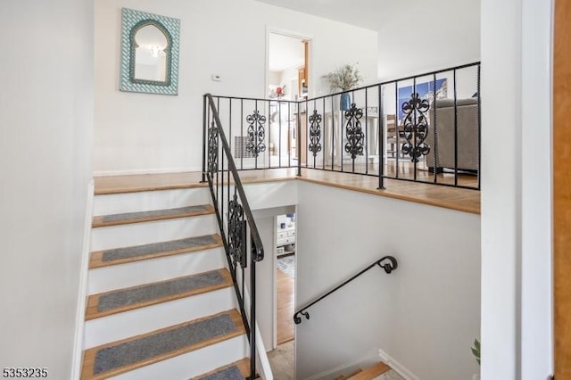 stairs featuring baseboards